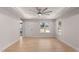 Bright living room with wood floors, a ceiling fan, recessed lighting, and lots of natural light at 306 E Godwin St, Dunn, NC 28334