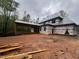 Exterior back view of a home under construction with a covered patio and exposed framing at 67 Ridgeline Ct # 7, Pittsboro, NC 27312