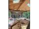 Covered back porch under construction with brick, wood beams, and wooded views at 67 Ridgeline Ct # 7, Pittsboro, NC 27312