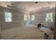Large bedroom under construction featuring multiple windows for natural light and ample space at 67 Ridgeline Ct # 7, Pittsboro, NC 27312