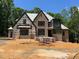 View of a brick home under construction with visible framing and building materials at 67 Ridgeline Ct # 7, Pittsboro, NC 27312