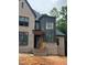 Newly built brick house with dark trim and a covered porch at 67 Ridgeline Ct # 7, Pittsboro, NC 27312