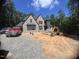 A stunning new construction home with a brick exterior and a spacious lot, situated near a wooded area at 67 Ridgeline Ct # 7, Pittsboro, NC 27312