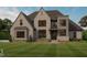 Rendering of a completed brick home with landscaping and a well-manicured lawn at 67 Ridgeline Ct # 7, Pittsboro, NC 27312