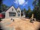Under construction brick home showcasing its modern architectural design and progress at 67 Ridgeline Ct # 7, Pittsboro, NC 27312