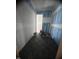 Hallway under construction with brick flooring being laid and wall priming in progress at 67 Ridgeline Ct # 7, Pittsboro, NC 27312