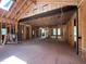 Open concept interior framing featuring exposed beams, studs, and natural lighting at 67 Ridgeline Ct # 7, Pittsboro, NC 27312