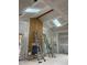 Living room under construction with plywood feature wall, skylights, and ready for finishing touches at 67 Ridgeline Ct # 7, Pittsboro, NC 27312