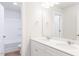 Bathroom featuring a double sink vanity with modern fixtures and a separate toilet and shower at 7417 Prato Ct, Wendell, NC 27591