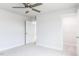 A bright bedroom features neutral walls and carpet with doors to the bathroom and closet at 7417 Prato Ct, Wendell, NC 27591
