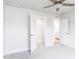 Bedroom with ceiling fan and adjacent large closet and ensuite bathroom at 7417 Prato Ct, Wendell, NC 27591