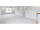 Spacious bonus room with neutral carpet, ceiling fan and natural light at 7417 Prato Ct, Wendell, NC 27591