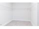 Walk-in closet with neutral carpet and wire shelving at 7417 Prato Ct, Wendell, NC 27591