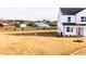 View of the new construction home with a three-car garage on a large lot at 7417 Prato Ct, Wendell, NC 27591