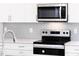 Modern kitchen features stainless steel appliances and a stylish backsplash at 7417 Prato Ct, Wendell, NC 27591