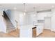 Lovely kitchen with a large island and stairs to the second floor in view at 7417 Prato Ct, Wendell, NC 27591