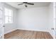 Bright home office area with hardwood floors, large window, ceiling fan and glass french doors at 7417 Prato Ct, Wendell, NC 27591