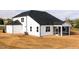 Rear exterior view of new construction home with a screened-in porch at 7417 Prato Ct, Wendell, NC 27591