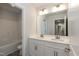 Elegant bathroom featuring double sink vanity, ample storage, and well-lit mirror at 225 Hopewell Branch Ct, Smithfield, NC 27577