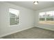 Comfortable bedroom featuring two large windows for ample sunlight and views at 225 Hopewell Branch Ct, Smithfield, NC 27577