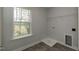 Laundry room with large window and gray tile floor at 225 Hopewell Branch Ct, Smithfield, NC 27577