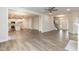 Open-concept living area leading to a modern kitchen with an island and a staircase to the upper level at 225 Hopewell Branch Ct, Smithfield, NC 27577