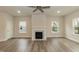 Spacious living room with a fireplace, recessed lighting, and a ceiling fan at 225 Hopewell Branch Ct, Smithfield, NC 27577