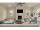 Cozy living room showcasing a fireplace, TV, and neutral tones for a relaxing atmosphere at 225 Hopewell Branch Ct, Smithfield, NC 27577