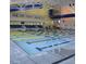 Indoor swimming pool with multiple lanes marked and flags hung around the facility at 225 Hopewell Branch Ct, Smithfield, NC 27577