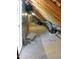 Attic space with exposed wood beams and insulation, offering potential for storage or renovation at 2525 Silas Peak Ln, Apex, NC 27523