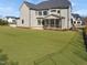 Expansive backyard showcasing a well-maintained lawn, ideal for outdoor activities and entertaining at 2525 Silas Peak Ln, Apex, NC 27523