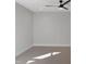 Spacious carpeted bedroom with a modern ceiling fan and recessed lighting at 2525 Silas Peak Ln, Apex, NC 27523