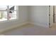 Bright bedroom with a large window view of the community at 2525 Silas Peak Ln, Apex, NC 27523
