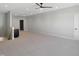 Expansive bonus room with plush carpeting, a wet bar and neutral walls at 2525 Silas Peak Ln, Apex, NC 27523