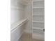 Well-organized closet with built-in shelving and hanging rods at 2525 Silas Peak Ln, Apex, NC 27523