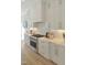 Modern kitchen with stainless steel stove and white cabinets at 2525 Silas Peak Ln, Apex, NC 27523