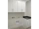 Functional laundry room with ample storage and counter space at 2525 Silas Peak Ln, Apex, NC 27523