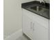 Close up of a laundry room sink with stone countertop at 2525 Silas Peak Ln, Apex, NC 27523