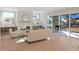 Bright living room with fireplace, hardwood floors, and sliding glass doors to patio at 2525 Silas Peak Ln, Apex, NC 27523