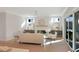 Bright living room with fireplace, hardwood floors, and sliding glass doors to patio at 2525 Silas Peak Ln, Apex, NC 27523