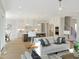 Open floor plan with view of kitchen and dining area at 2525 Silas Peak Ln, Apex, NC 27523