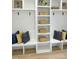 Organized mudroom with lockers, built-in benches, and decorative pillows at 2525 Silas Peak Ln, Apex, NC 27523