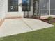 Patio area leading to the lawn and a screened-in porch, perfect for outdoor relaxation at 2525 Silas Peak Ln, Apex, NC 27523