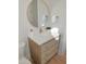 Elegant powder room with modern vanity, brushed gold fixtures, and decorative accents at 2525 Silas Peak Ln, Apex, NC 27523