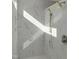 Bright shower with marble-look tiles, built-in shelving and dual shower heads at 2525 Silas Peak Ln, Apex, NC 27523