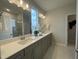 Bright bathroom with double vanity, quartz counters, and modern fixtures at 321 Murray Grey Ln, Wake Forest, NC 27587