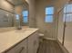 Modern bathroom featuring a large vanity with quartz countertop and a glass-enclosed shower at 321 Murray Grey Ln, Wake Forest, NC 27587