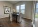 Dining room featuring a modern table, four chairs, hardwood flooring, and natural light from multiple windows at 321 Murray Grey Ln, Wake Forest, NC 27587