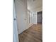 Modern bathroom featuring a glass enclosed shower and sleek wood style flooring at 104 Gin Branch Rd, Wendell, NC 27591