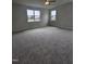 Carpeted bedroom with natural light from windows and neutral wall paint at 104 Gin Branch Rd, Wendell, NC 27591